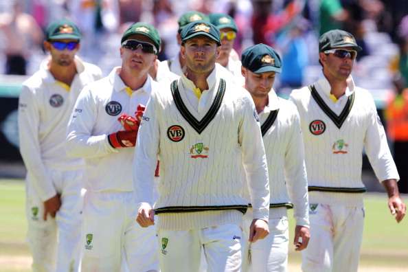 Michael Clarke leads a shocked Australian team out